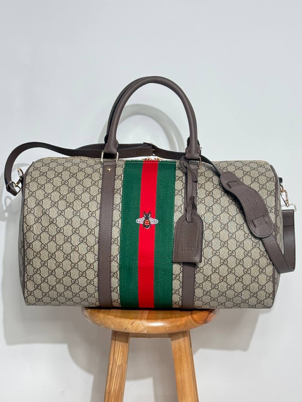 g.g bee-themed suitcase-style bag