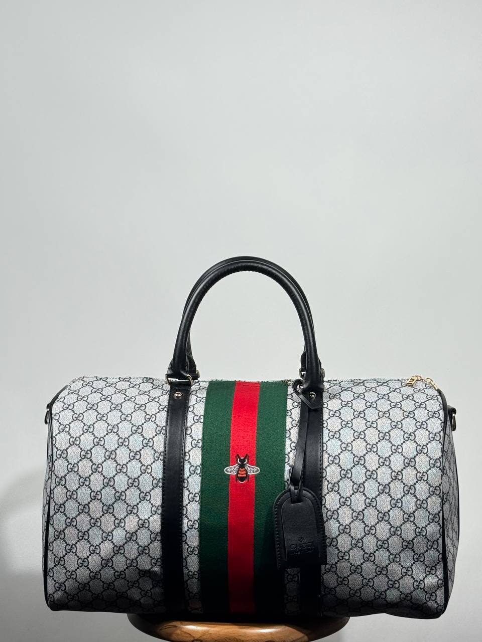 g.g bee-themed suitcase-style bag